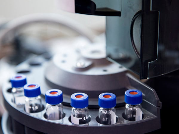 vials are arranged in the auto-sampler for the lab equipment.